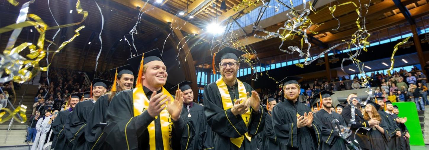 A group of graduations celebrating during Commencement