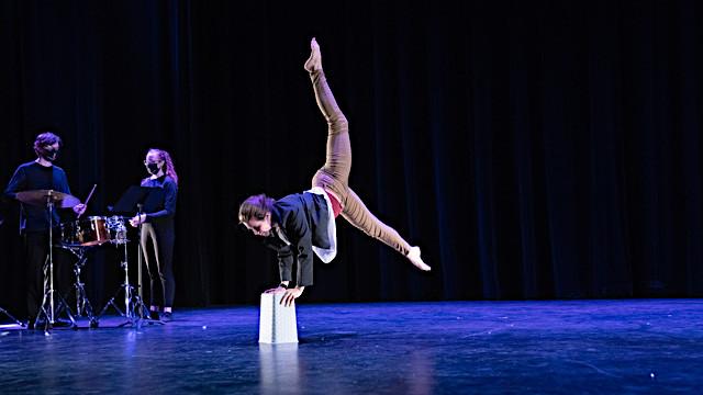 dancer with bucket on stage